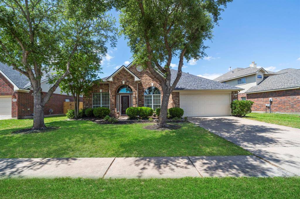 A double wide driveway and attached 2-car garage provides ample off-street, protected parking for family and guests.