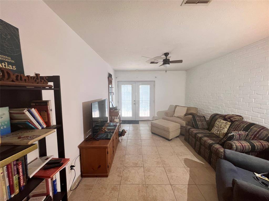 Spacious living area with french doors to patio.