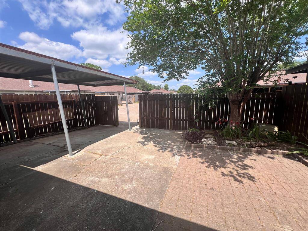 View of courtyard and parking area from living area.