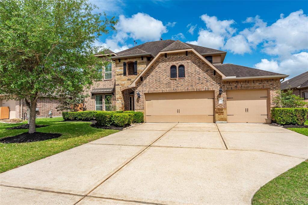 Check out this 3 car garage AND extended driveway for multiple car parking