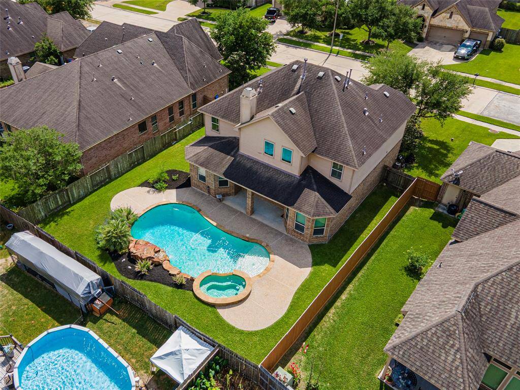 Yard still has green space even with the pool