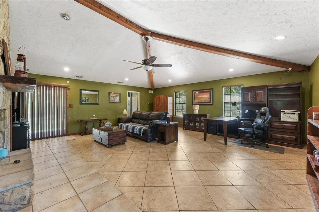 Large living room with tile flooring