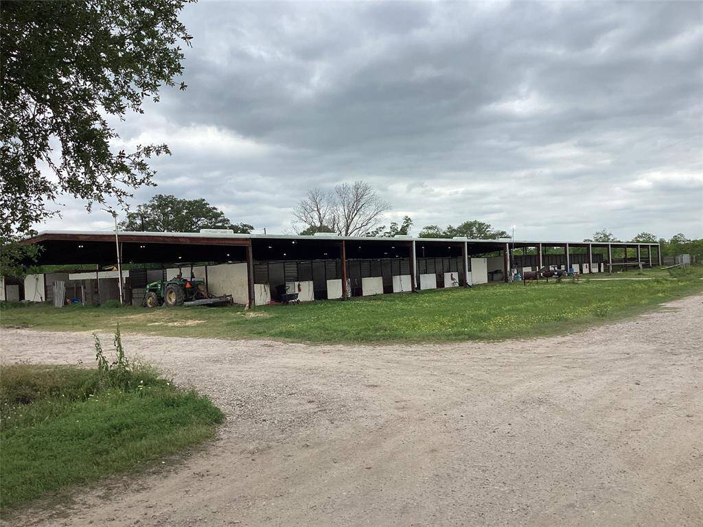 Stables with lighted covered arena at the back