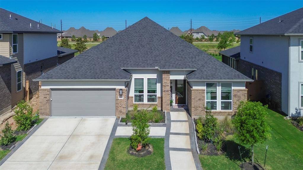 Welcome to 7615 Laurel Bloom Ln—a stunning, modern home featuring sleek design, abundant natural light, and a spacious layout perfect for comfortable living. Enjoy a beautifully landscaped front yard and a welcoming entryway, all in a desirable neighborhood. Your dream home awaits!