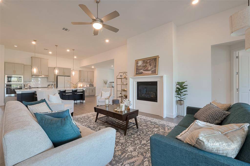 Expansive and inviting family room, overlooking an open concept floor plan.