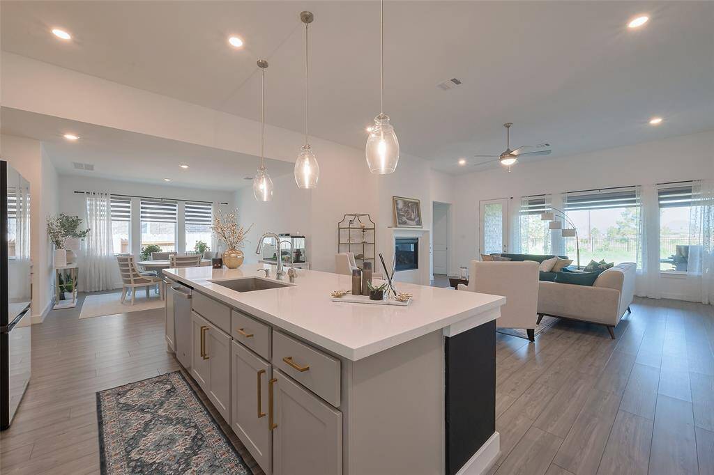 Experience seamless living with this open-concept design, where the kitchen seamlessly flows into the inviting family area.