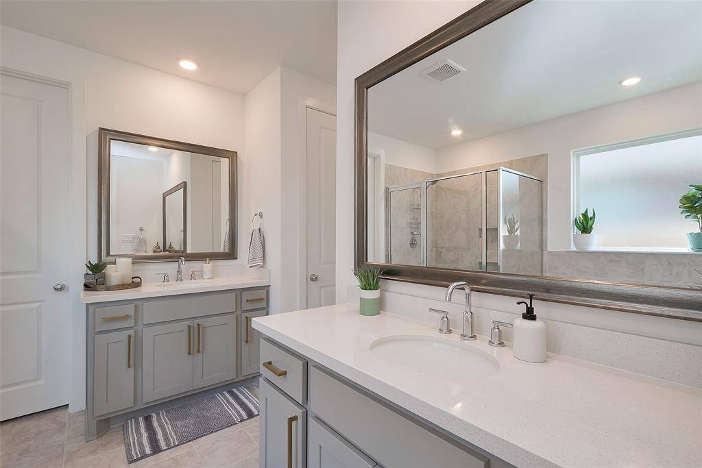 Experience luxury with spacious dual vanities, perfect for a stylish and functional bathroom.