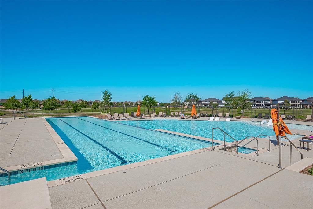 Enjoy relaxing and socializing at the inviting community pool, perfect for sunny days.