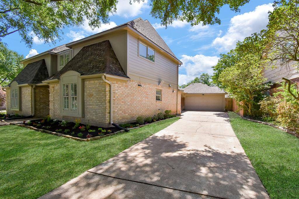 This charming two-story home features a brick exterior with a new roof and a spacious driveway leading to a hard to find detached garage. Surrounded by well-maintained landscaping and mature trees, it offers a welcoming and serene atmosphere.