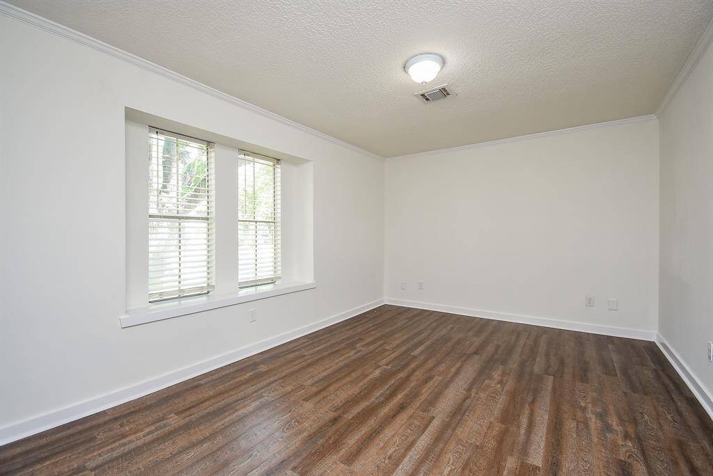 This large flex room could be used as an office, bedroom, media room or any other purpose you can find! Featuring a clean, bright space with neutral walls, and rich vinyl plank flooring. A large window allows natural light to fill the room, creating a welcoming atmosphere.