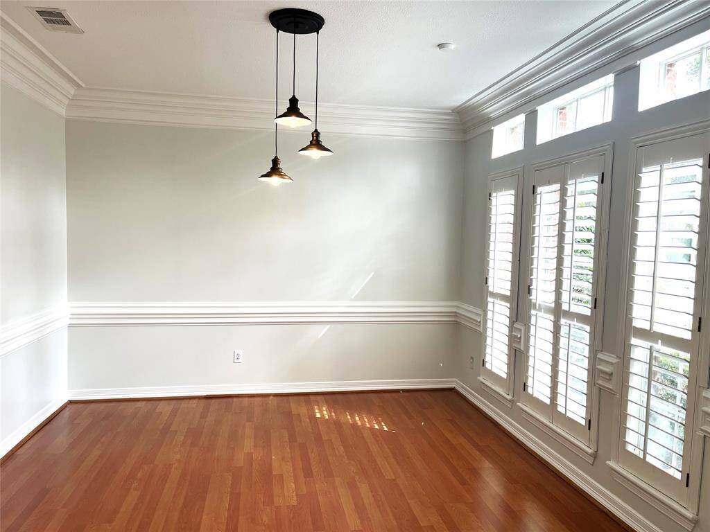 Plantation shutters and updated lighting in the dining room