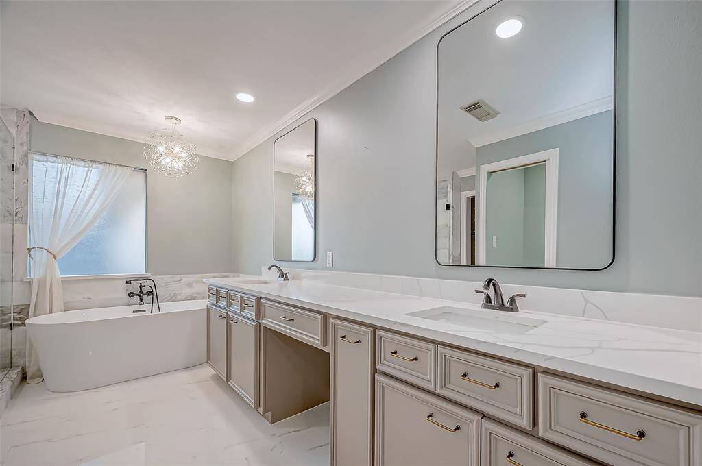 This primary bathroom has been completely updated.  Paint, mirrors, countertops, drawer and cabinet pulls, bath and shower.  All have been updated to your satisfaction.