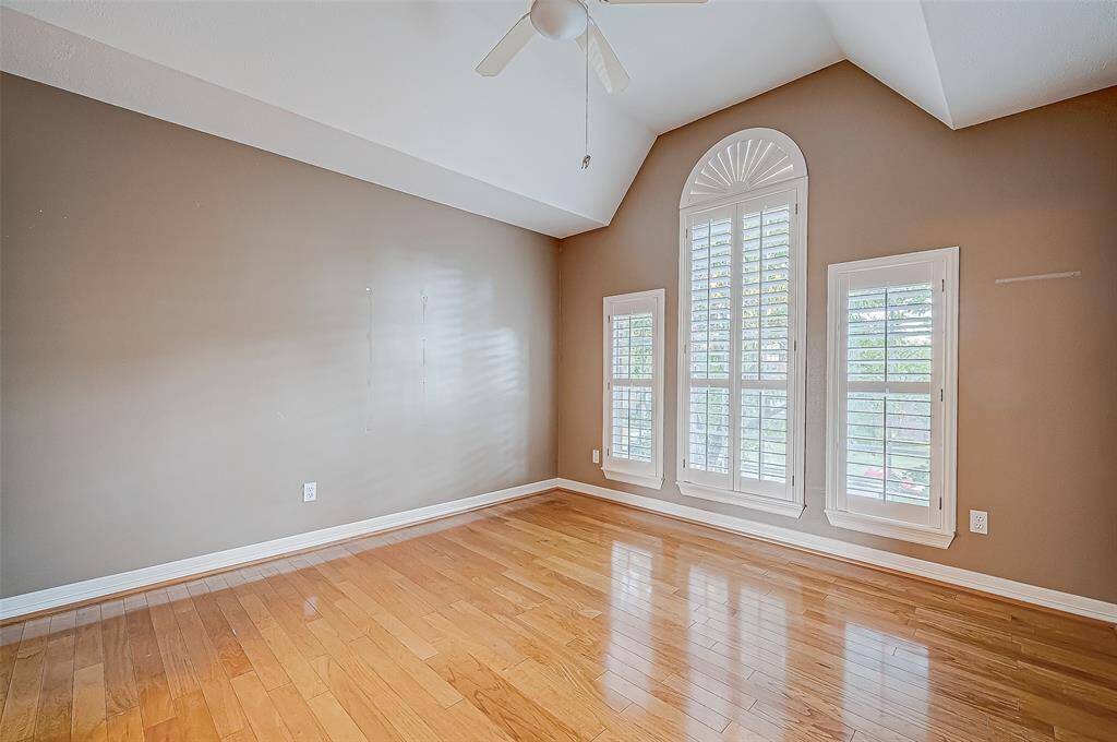 Third Bedroom features hard wood floors, high ceilings, plantation shutters and nice size closet