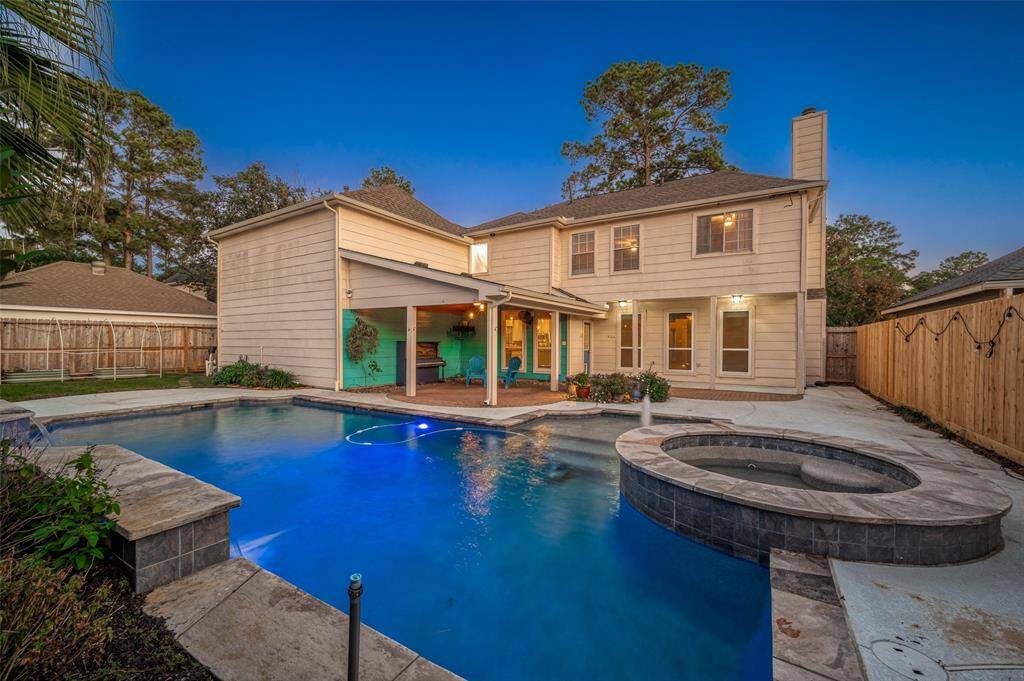 Dusk photo of the pool and back yard.