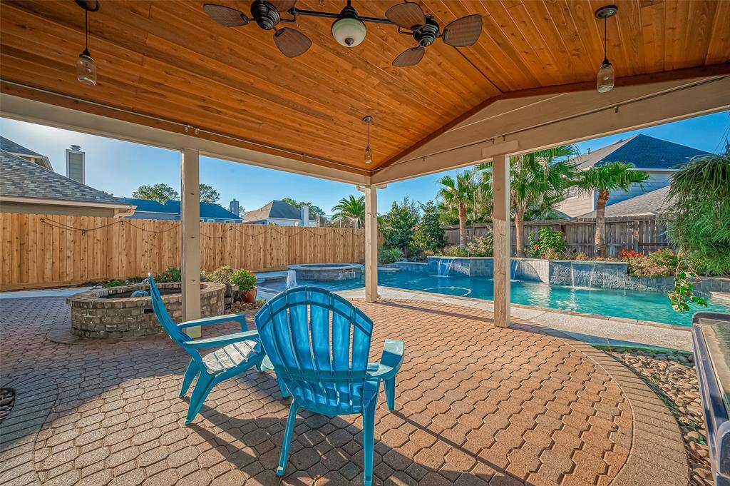Nice covered back patio for those relaxing evenings sitting by the pool