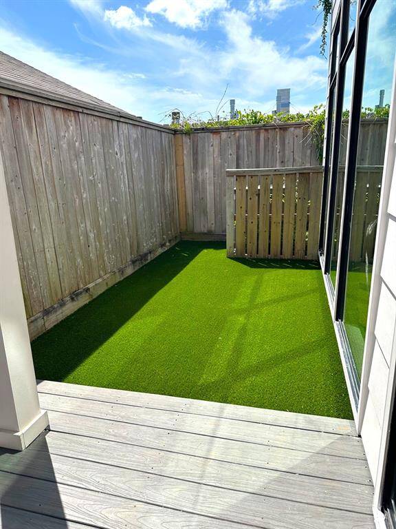 Back patio with turf area.