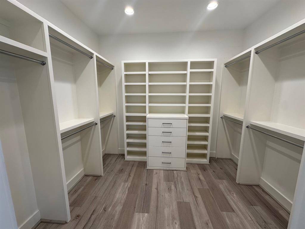 Second floor hall with two storage areas and laundry.