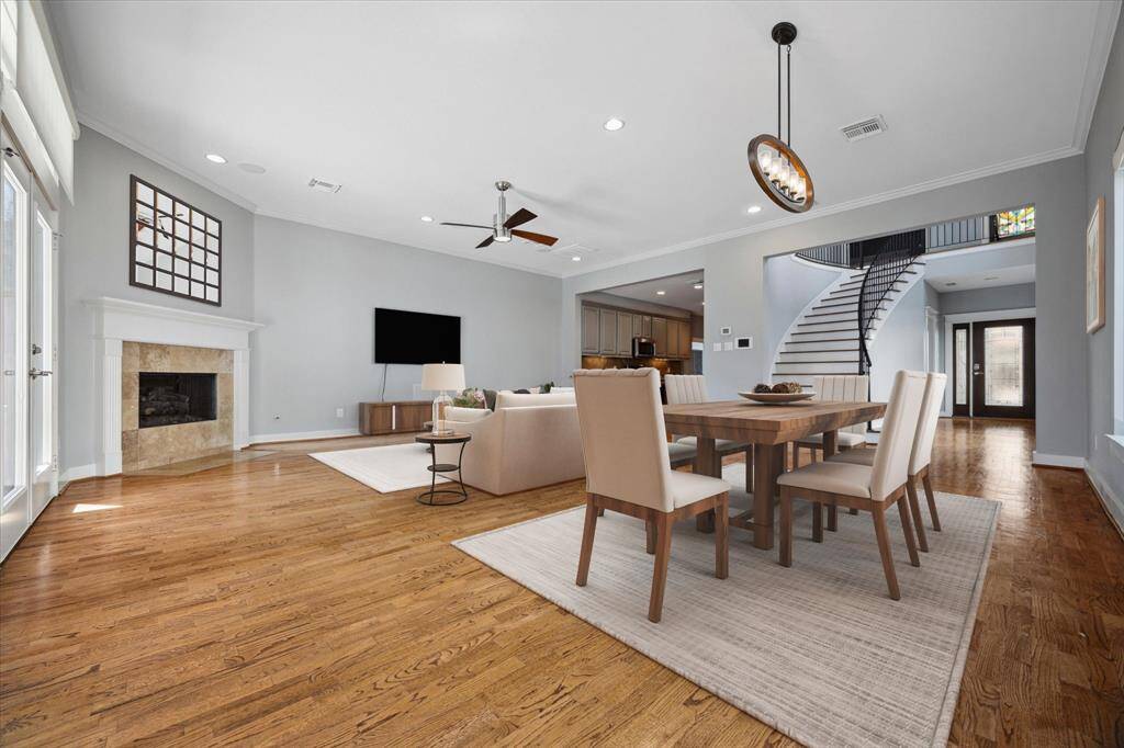 Virtually Staged: Open Living Room w/floor to ceiling w/gas fireplace & double French Doors. Leads to back porch living area. Enjoy this amazing open space!