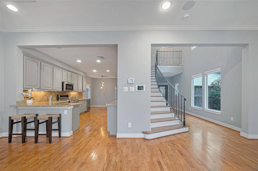 Stunning open kitchen w/ granite counter tops. All appliances stay!