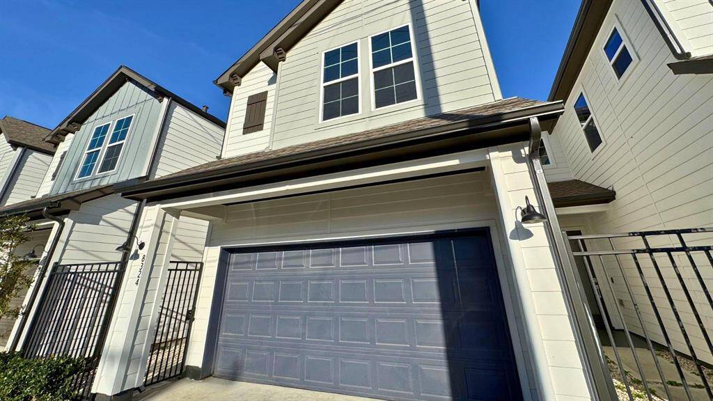 Large 2 car garage just inside this gated community