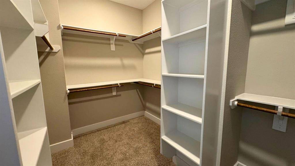 Huge walk in closet with builtins will keep you organized!