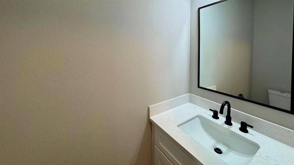 Half bath off of the living area is perfect for guests.