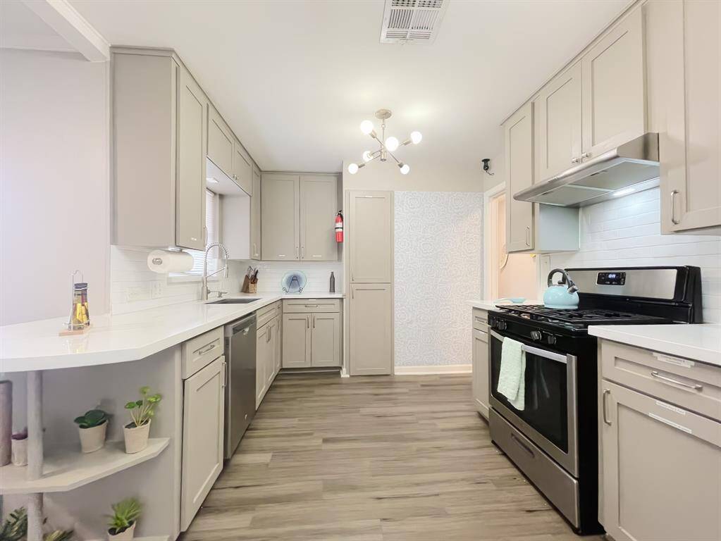 Quartz, updated backsplash and ample storage