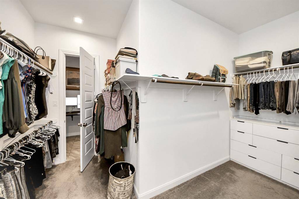 Spacious primary closet.