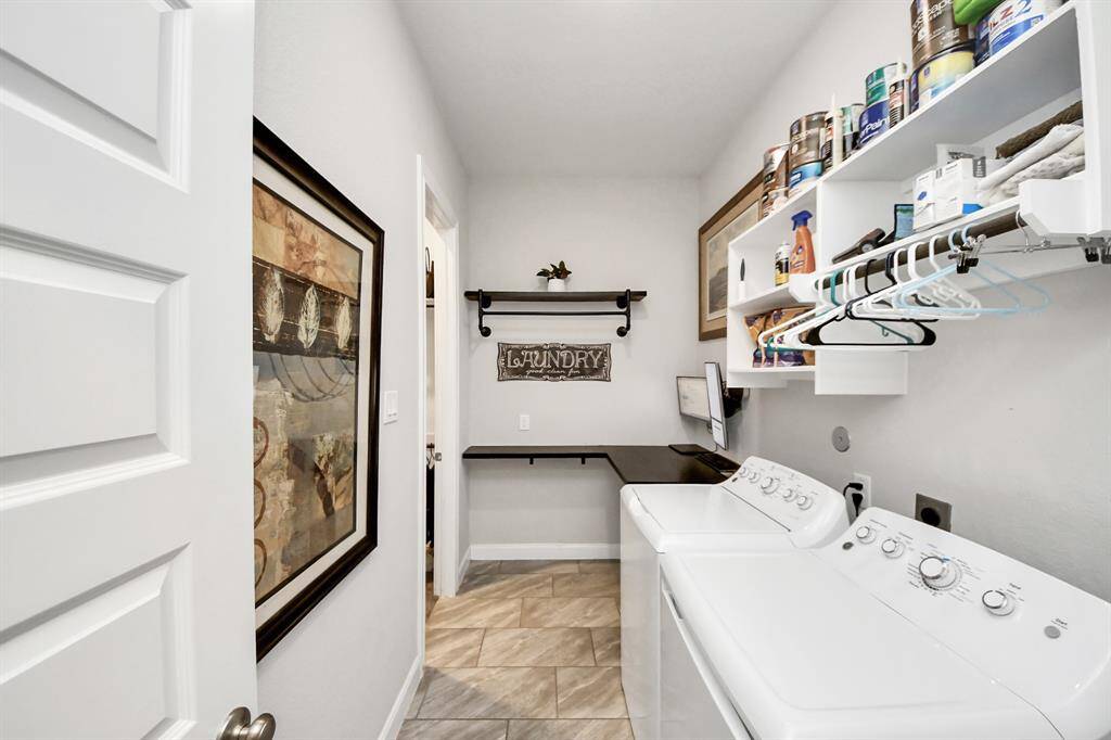 The primary closet conveniently connects to the laundry room.
