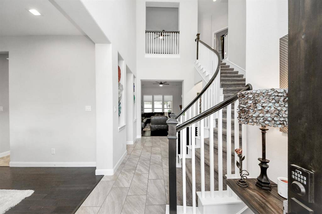 20 ft grand entrance with stunning spiral staircase welcomes guests.