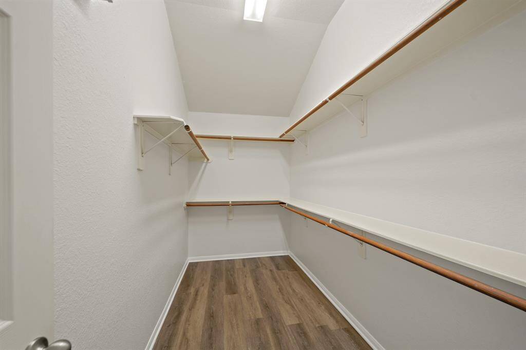 Look at the tons of storage this closet has to offer! Includes wood floors, high ceiling, and all in your very own bedroom!