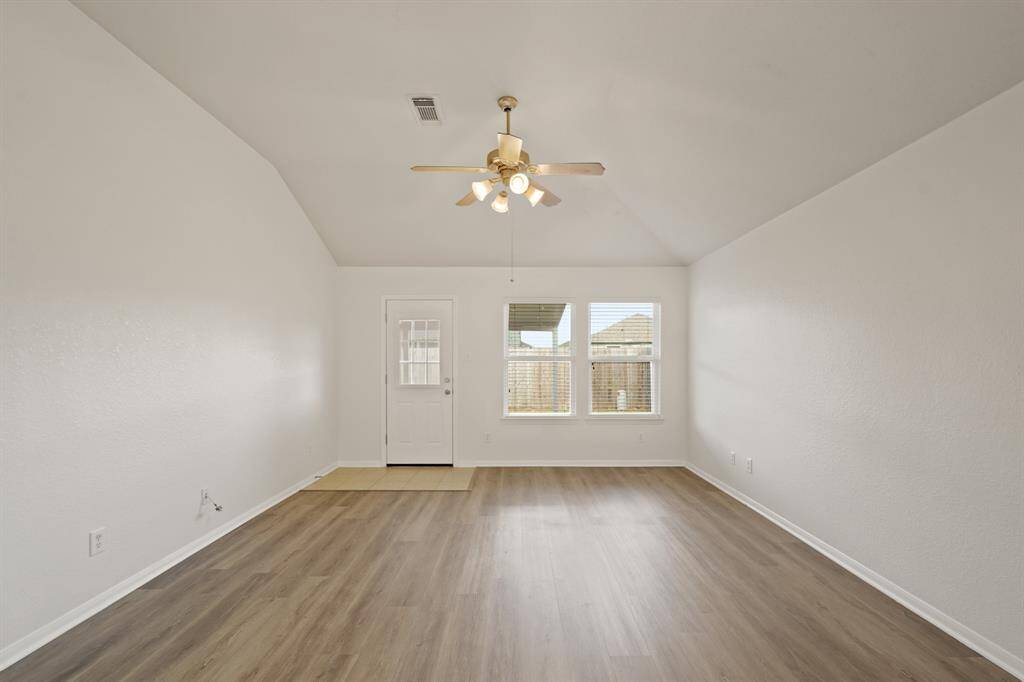 It is complete with large windows that provide a beautiful view of the backyard and tons of natural light in throughout the day!