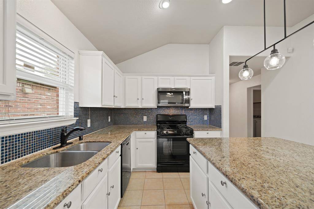 There is plenty of counter space and room for storage in this amazing kitchen!