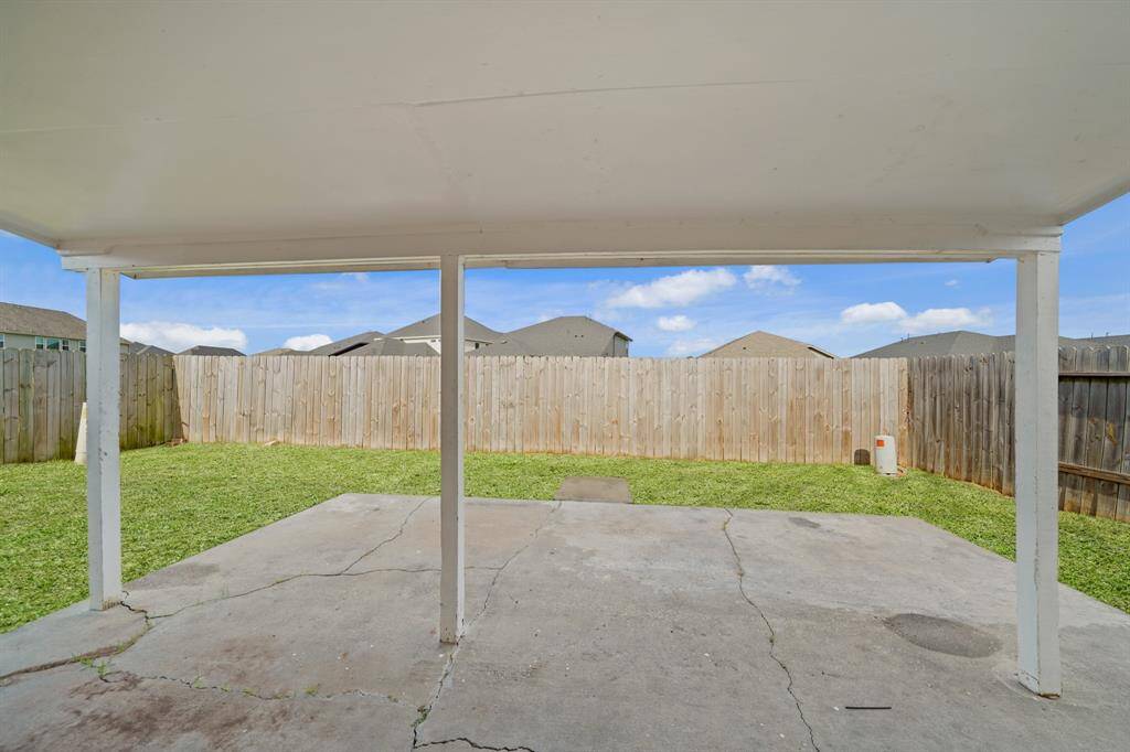 Get out from under the Texas sun, but still enjoy the great outdoors under this amazing covered patio!