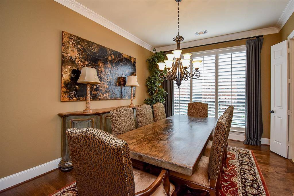 Plantation shutters let light in and can provide total privacy. Entry into the butlers pantry from the door on the right side of the photo.