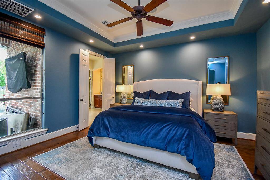 Plenty of space in this primary suite. Hardwood flooring and recessed lighting provide a nice ambience.