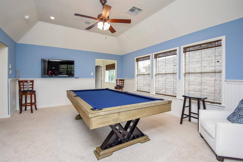 Second view of the game room with entry to the media in the background.