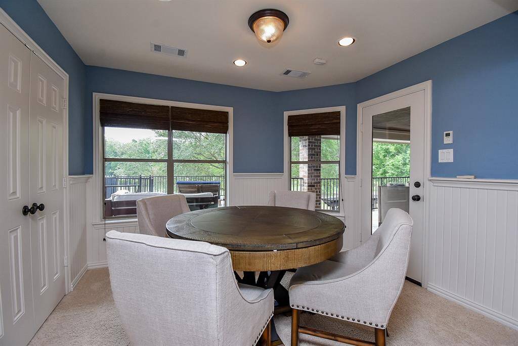 The card room has a nice storage closet and bay windows. Easy access to the balconies.