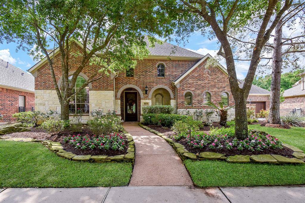 Located on a quiet culdesac this home won't disappoint.Beautiful curb appeal is enhanced with lush landscaping. Stone and brick facade accent the arched covered front porch. Maturing trees provide shade in those warmer summer months.