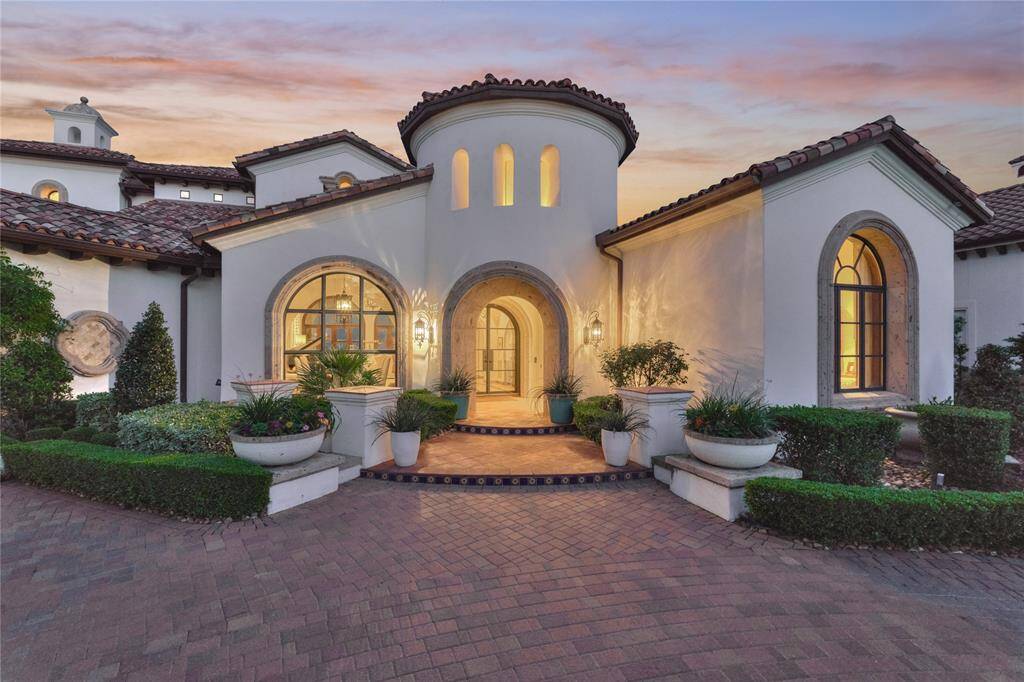 Gorgeous custom solid glass doors open to breathtaking views both inside and out.