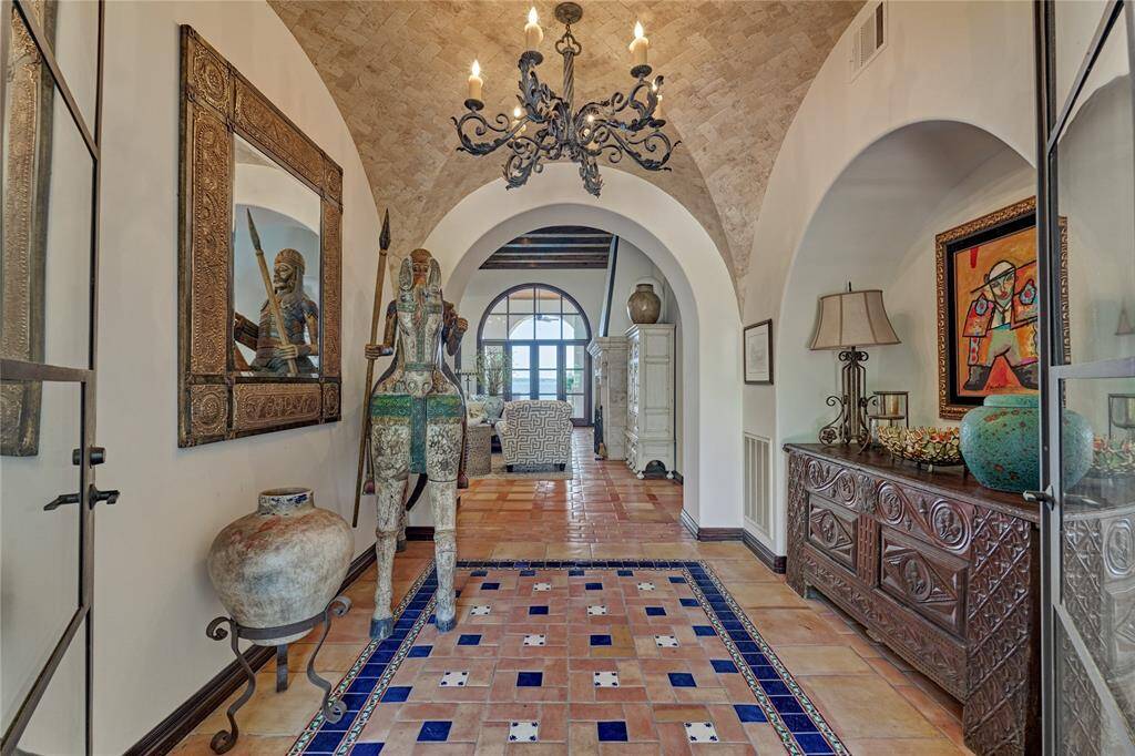 Inviting formal entry with groin detailed ceiling transitions easily to the open living.