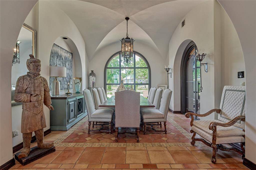 The formal dining space offers classic elegance, your guests are sure to appreciate.