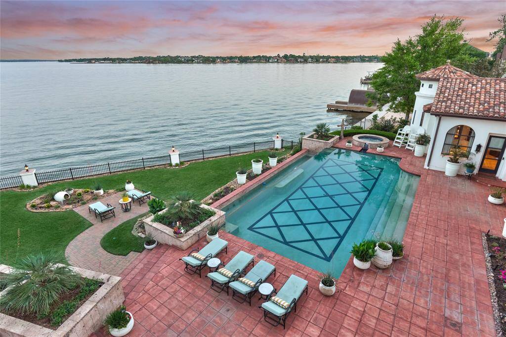 Balcony view showcases the backyard lighting and evening ambiance.