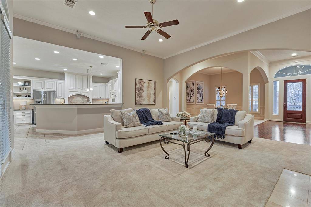 The open floorplan allows for a seamless flow when entertaining. The archways in the living and dining rooms create an elegant ambiance.