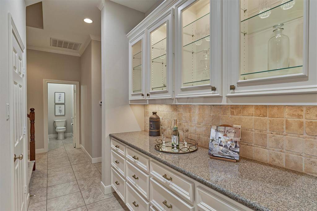 This built-in hutch could also be used as a butler's pantry. The door on the left is to the food pantry.