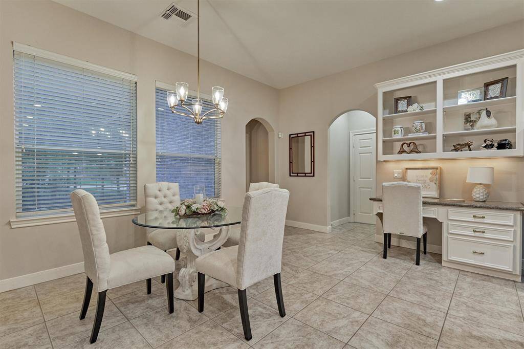 The breakfast room is the perfect spot to enjoy your morning coffee. A built-in desk area is convenient for paying bills or planning out your favorite recipes for the week.