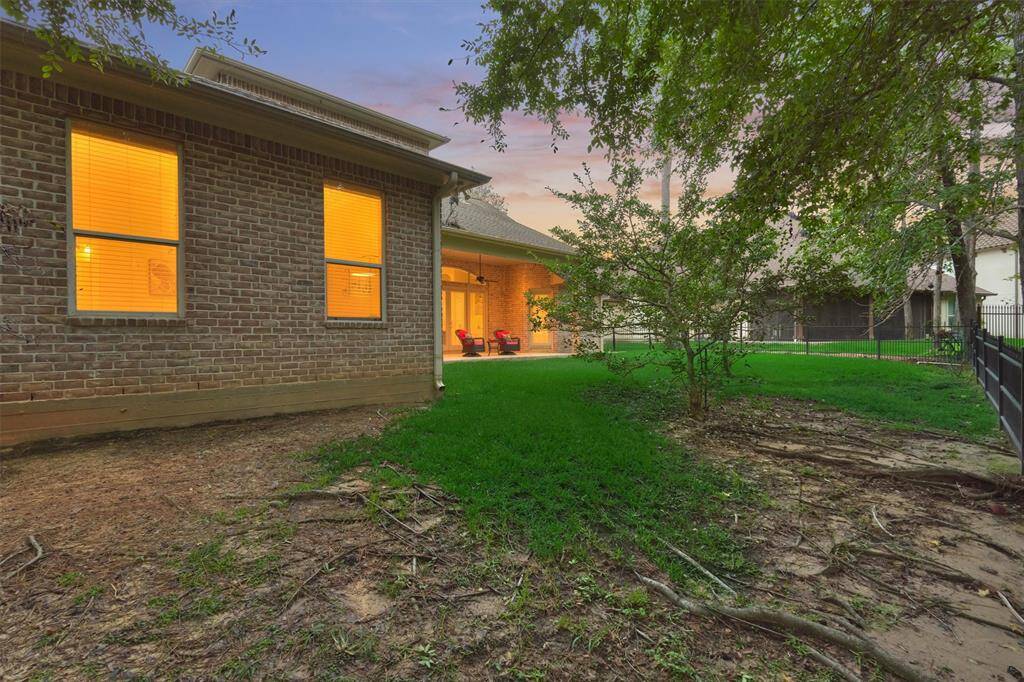 This is a view of the back yard. There is plenty of room for a future pool if desired.