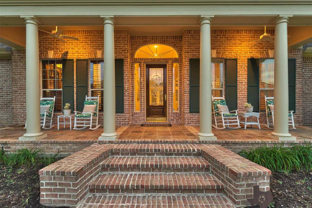 A welcoming front porch with shutters and stately columns for that ultimate southern charm! All you will need to bring are your rocking chairs and some sweet tea!