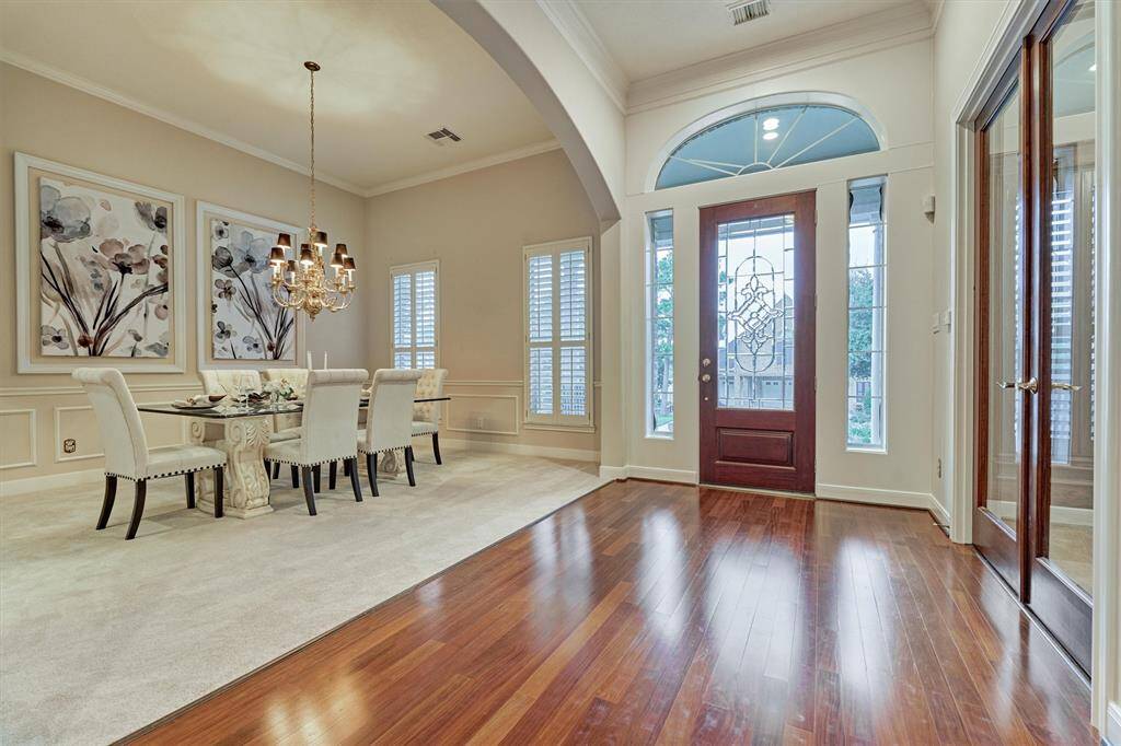 A look back at the foyer showing the natural light shining in from the windows. The dining room is to the left.