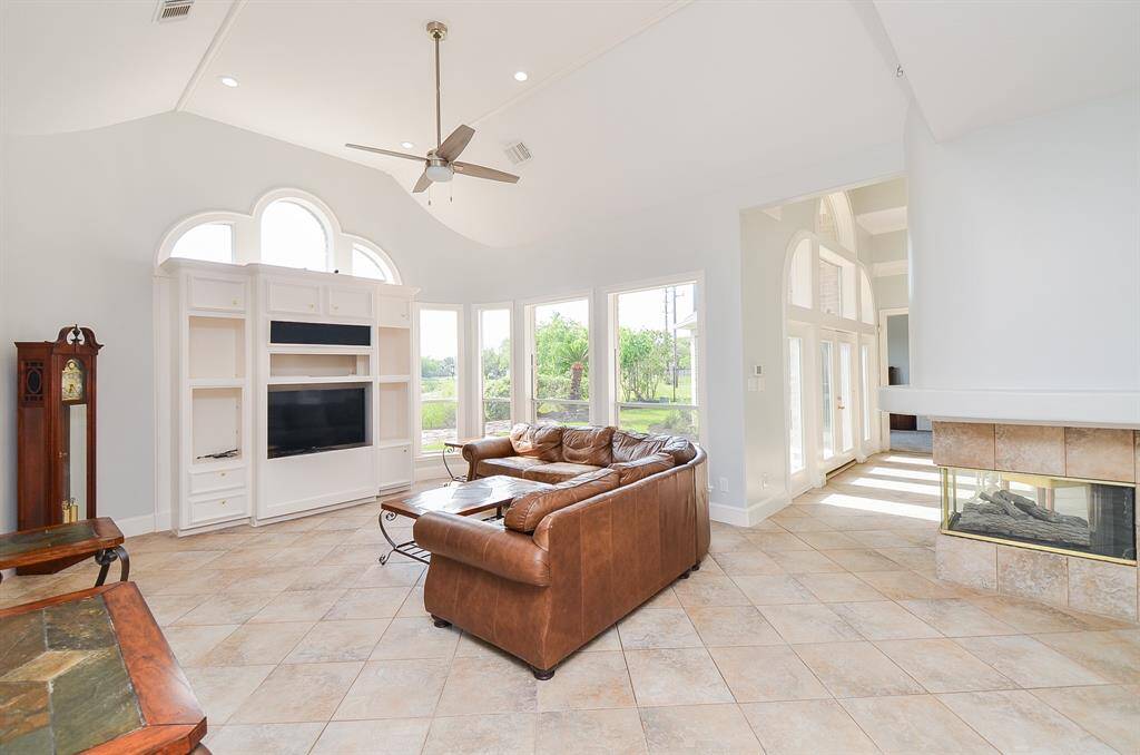 The Family Room has High Ceilings, Built-in Cabinetry and Plenty of Natural Lighting to Let the Sunshine In!